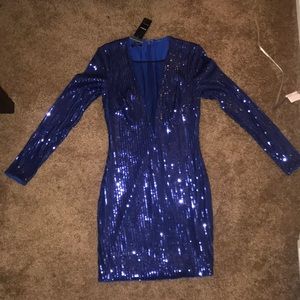 BEBE blue sequin long sleeved mini dress